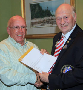 Bill Goddard receives the 50 years of service award from 1st Vice District Governor, Neil Iverson